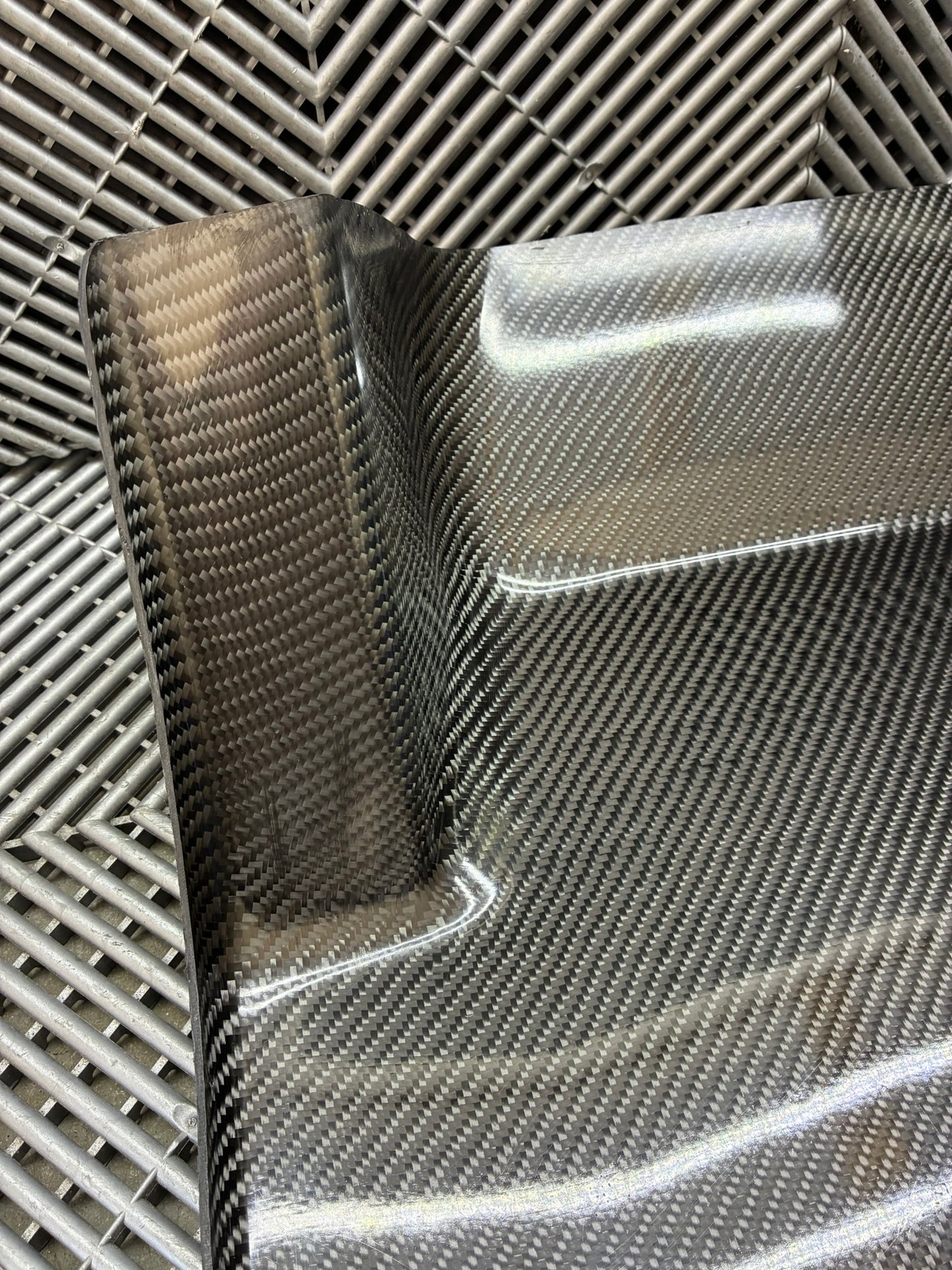 New. Carbon fiber driver side foot rest plate