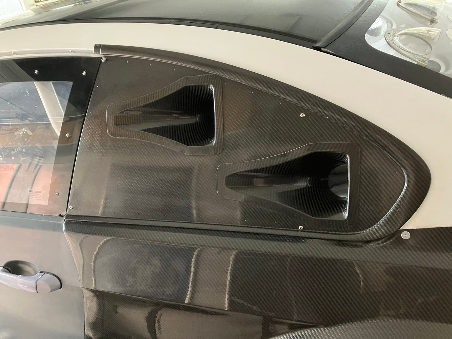 Used. Rear left side dry carbon window cover for Bmw E92 with Nasa Ducts.