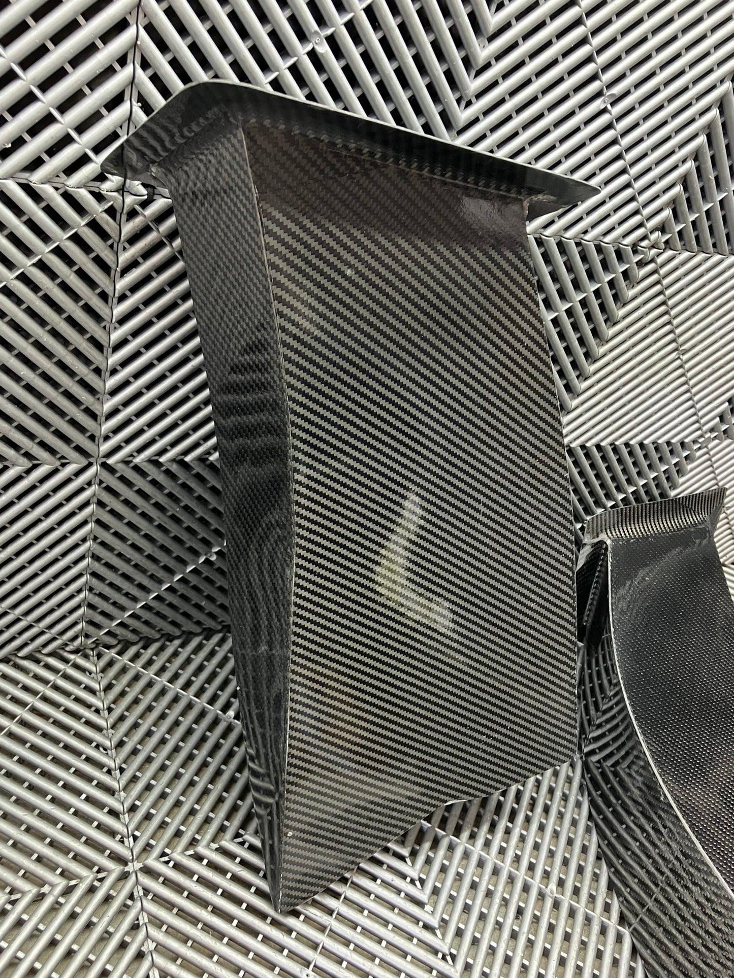 New. Set of front bumper/diffuser air ducts. Carbon fiber