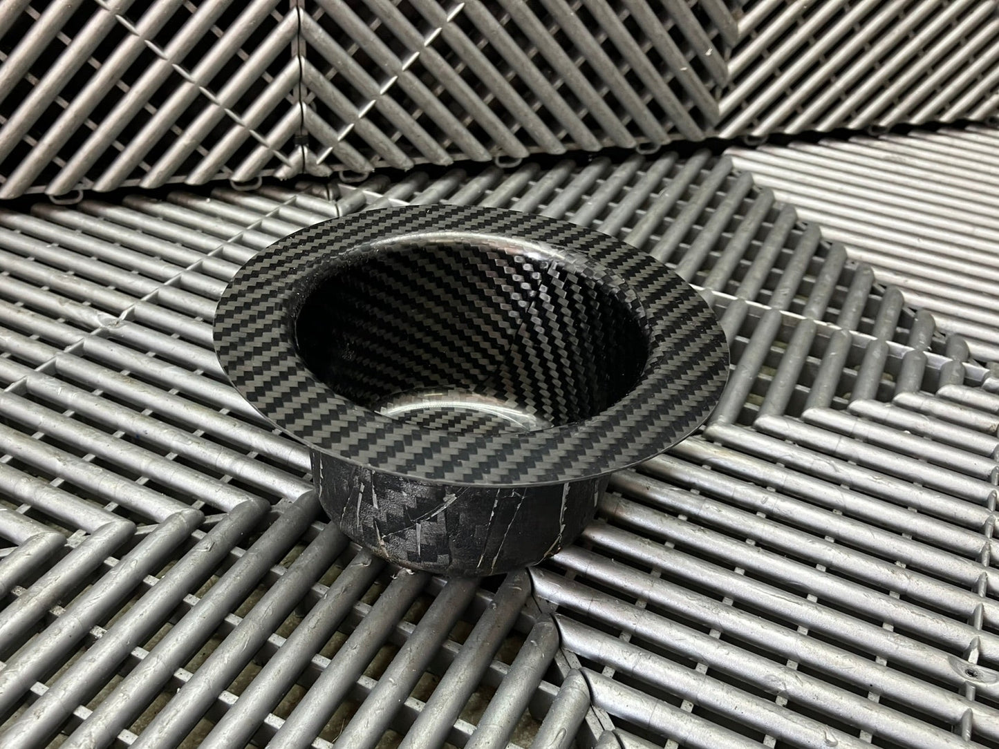 New. Air jack connecting valve mounting bracket. Carbon fiber.