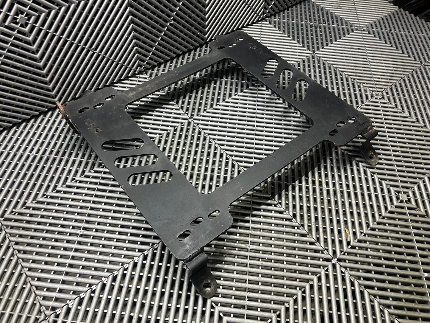 Used. Nissan 350z race seat bracket/base. Left side (driver)