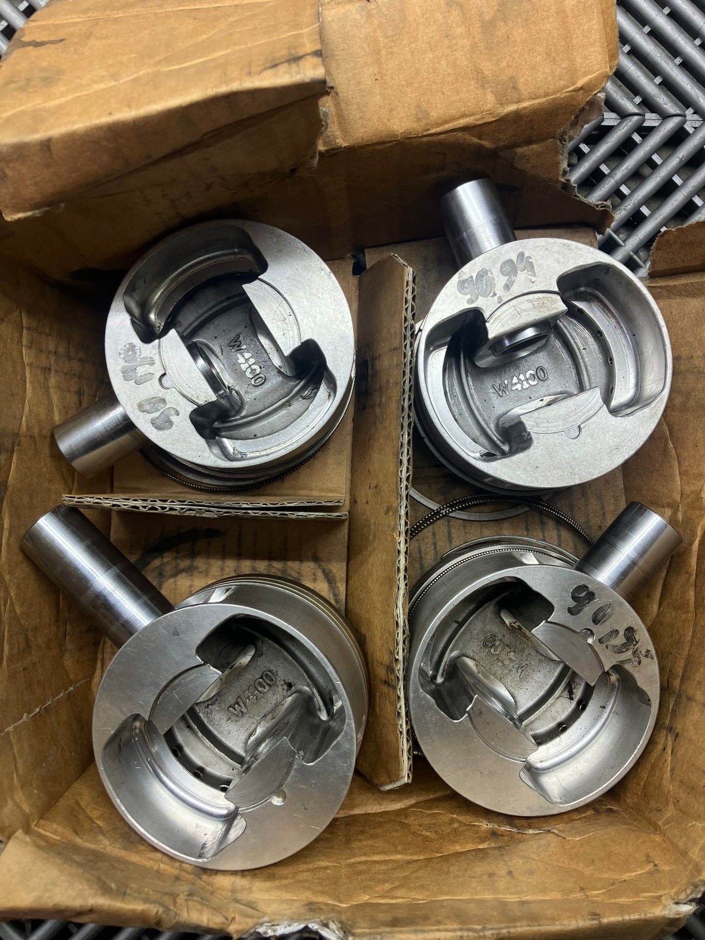 Used. Escort-Sierra Cosworth engine Mahle pistons.