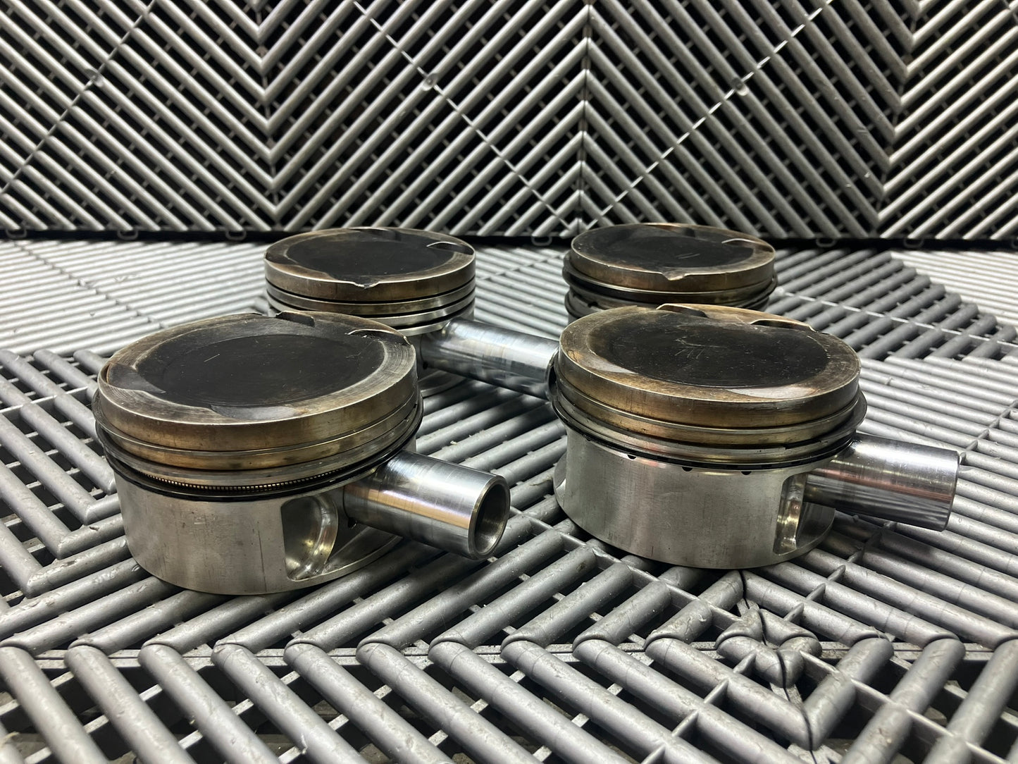 Used. Escort-Sierra Cosworth engine Mahle pistons.