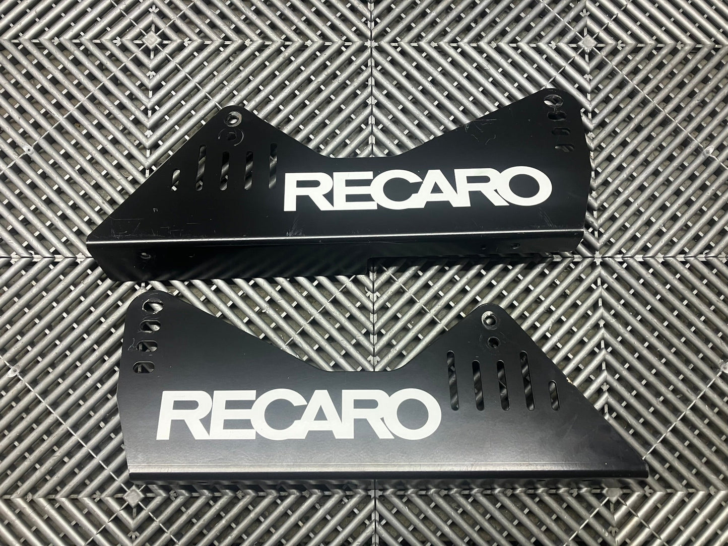 Used. Recaro seat side mounts.