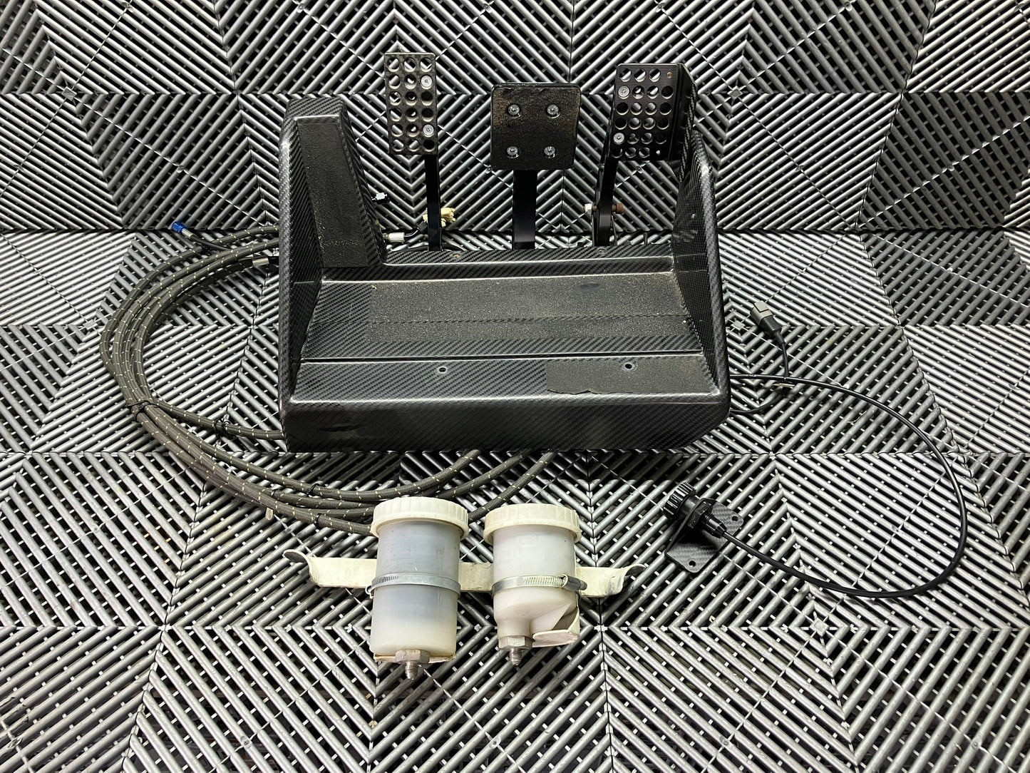 Used. AP racing Pedal Box Complete with Master Cylinders. Carbon fiber.