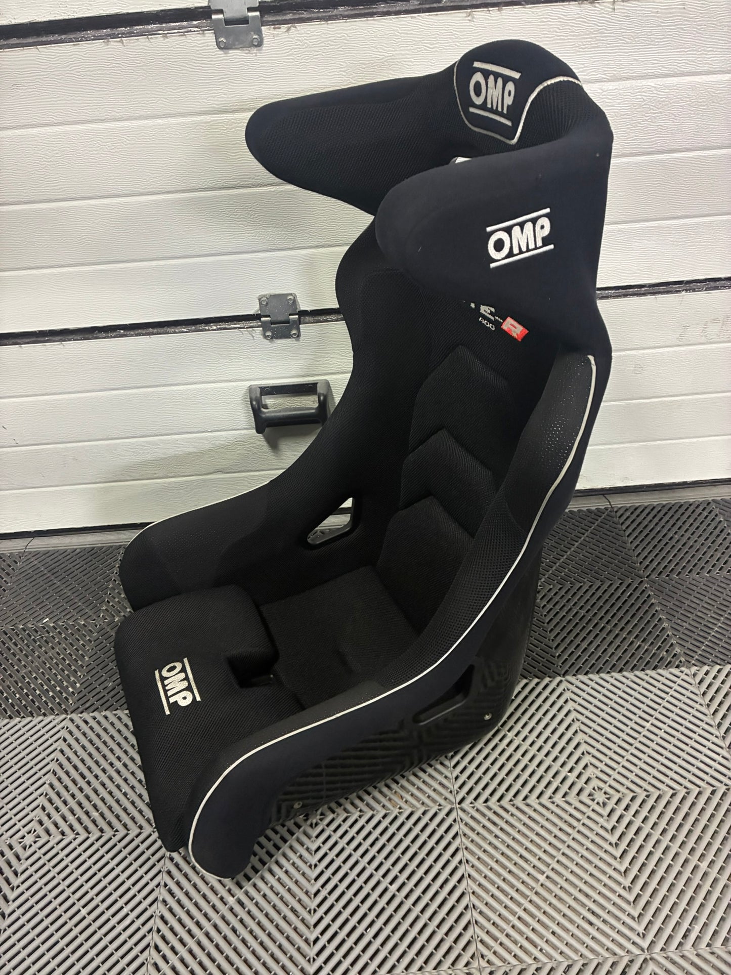 Used. OMP HTE-R 400 Fiberglass Racing seat.