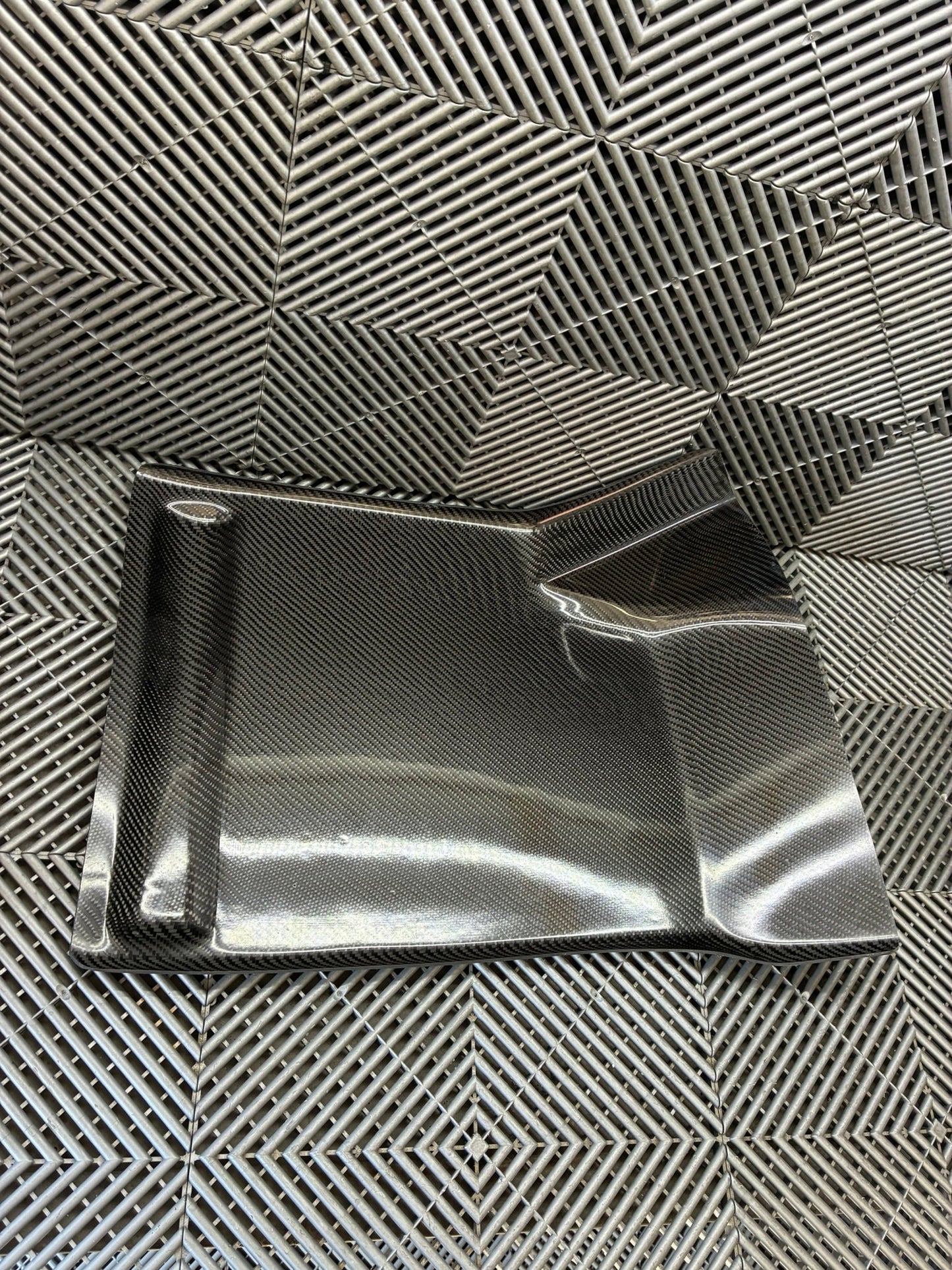 New. Carbon fiber driver side foot rest plate