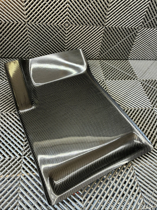 New. Carbon fiber driver side foot rest plate