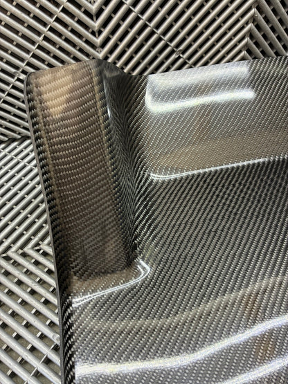 New. Carbon fiber driver side foot rest plate