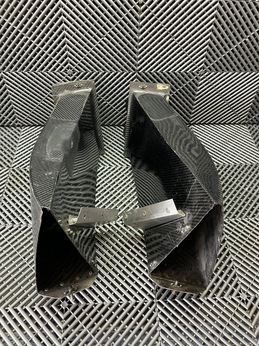 Used. Set of front bumper/diffuser air ducts. Carbon fiber