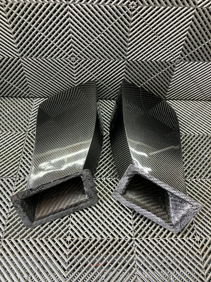 New. Set of front bumper/diffuser air ducts. Carbon fiber