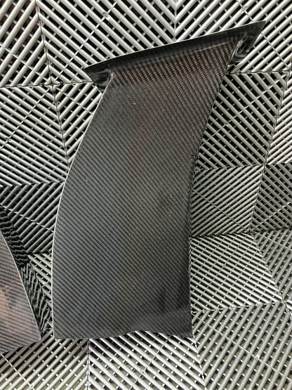 New. Set of front bumper/diffuser air ducts. Carbon fiber