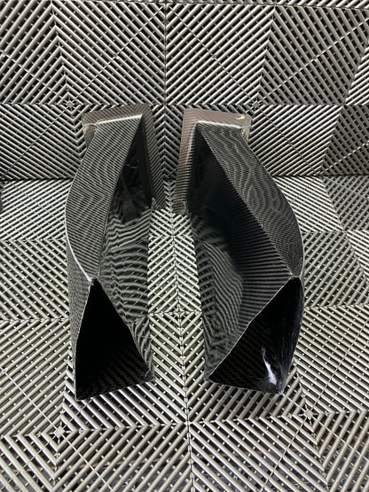 New. Set of front bumper/diffuser air ducts. Carbon fiber