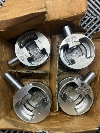 Used. Escort-Sierra Cosworth engine Mahle pistons.