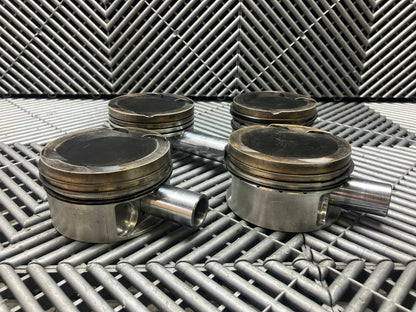 Used. Escort-Sierra Cosworth engine Mahle pistons.