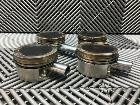 Used. Escort-Sierra Cosworth engine Mahle pistons.