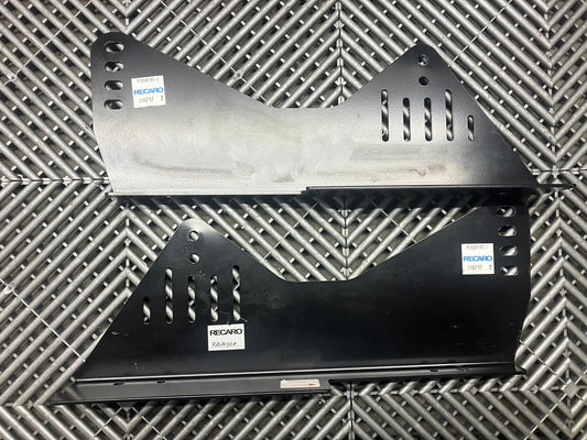 Used. Recaro seat side mounts.