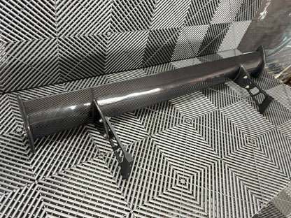 Used. Carbon Gt4 style rear wing. With high risers.