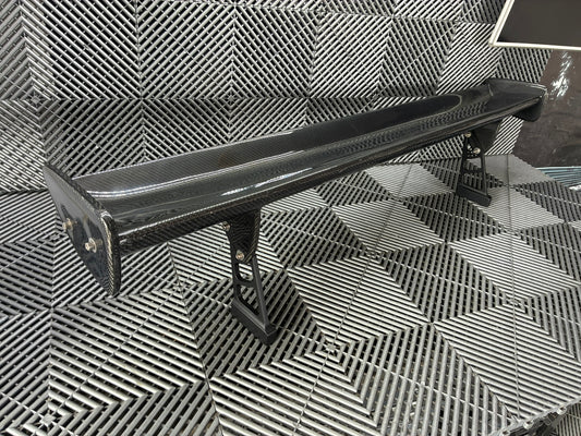 Used. Carbon Gt4 style rear wing. With high risers.