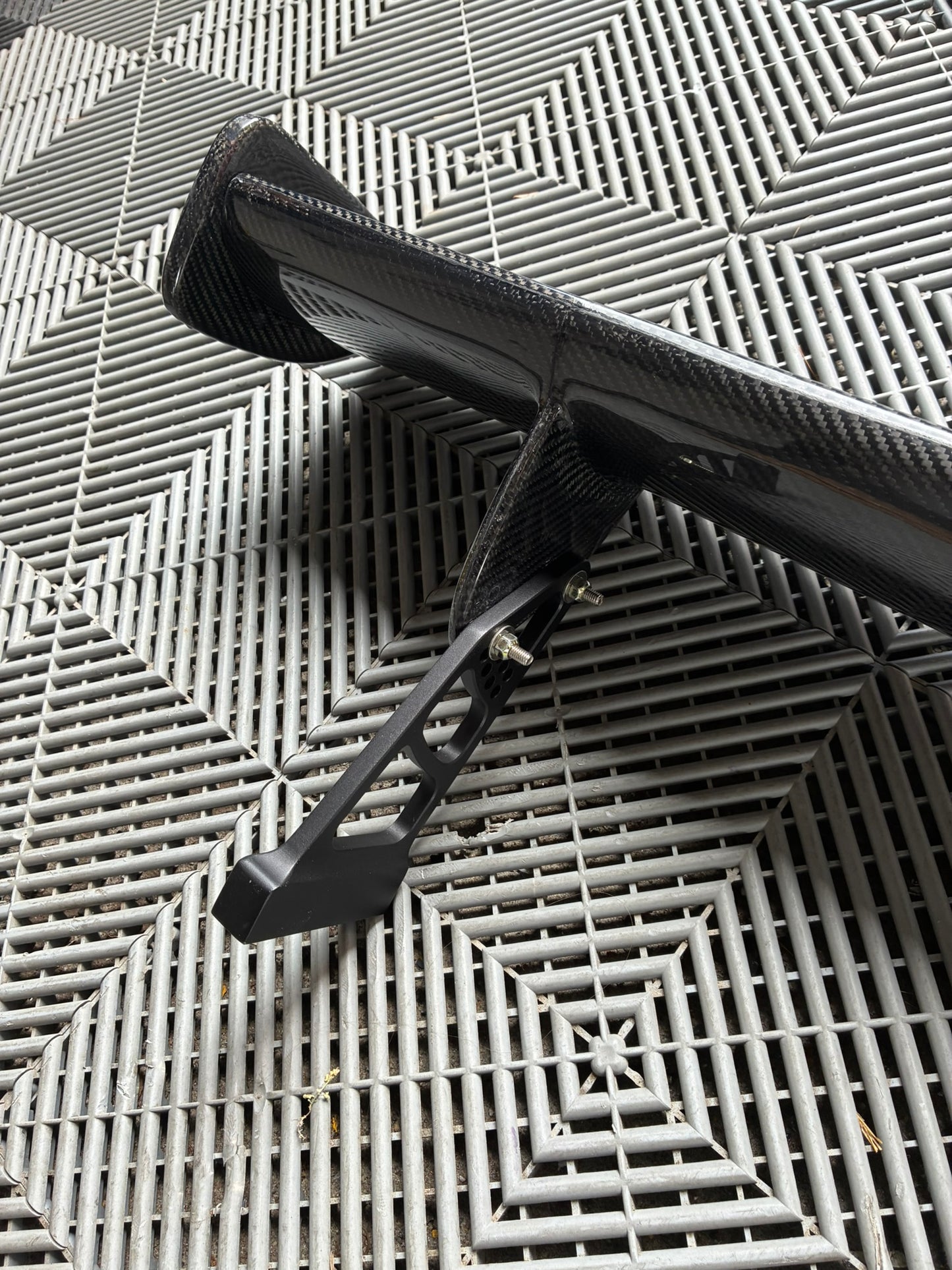 Used. Carbon Gt4 style rear wing. With high risers.