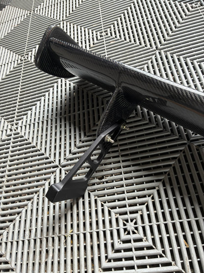 Used. Carbon Gt4 style rear wing. With high risers.