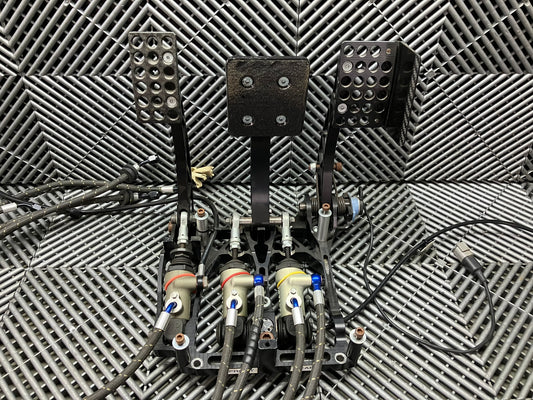 Used. AP racing Pedal Box Complete with Master Cylinders. Carbon fiber.