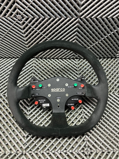 Used. Sparco steering wheel with adapter + wiring + buttons