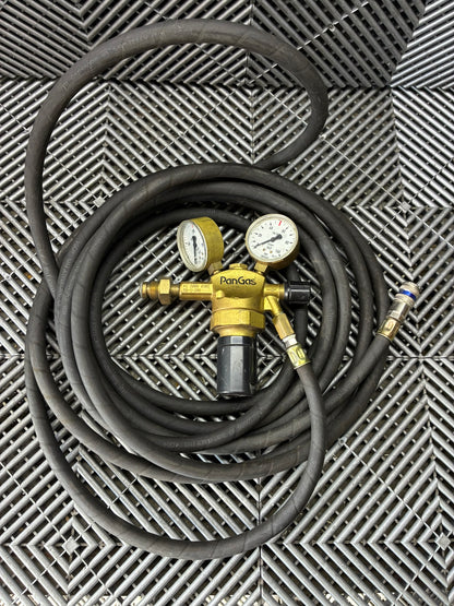 Used. Gas pressure regulators with the hose.