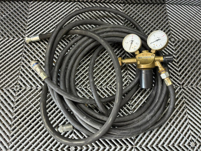 Used. Gas pressure regulators with the hose.