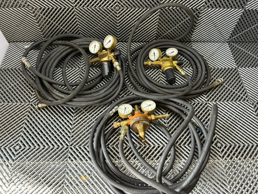Used. Gas pressure regulators with the hose.