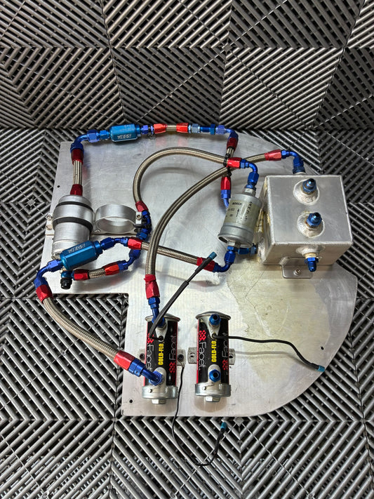 Used. Fuel surge tank and pump assembly mounted on an aluminum baseplate.