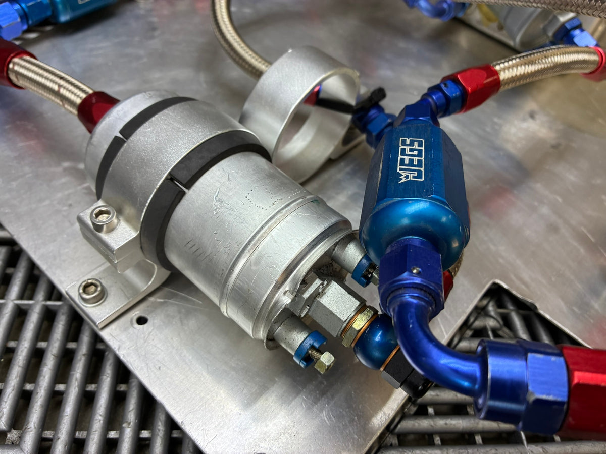 Used. Fuel surge tank and pump assembly mounted on an aluminum baseplate.