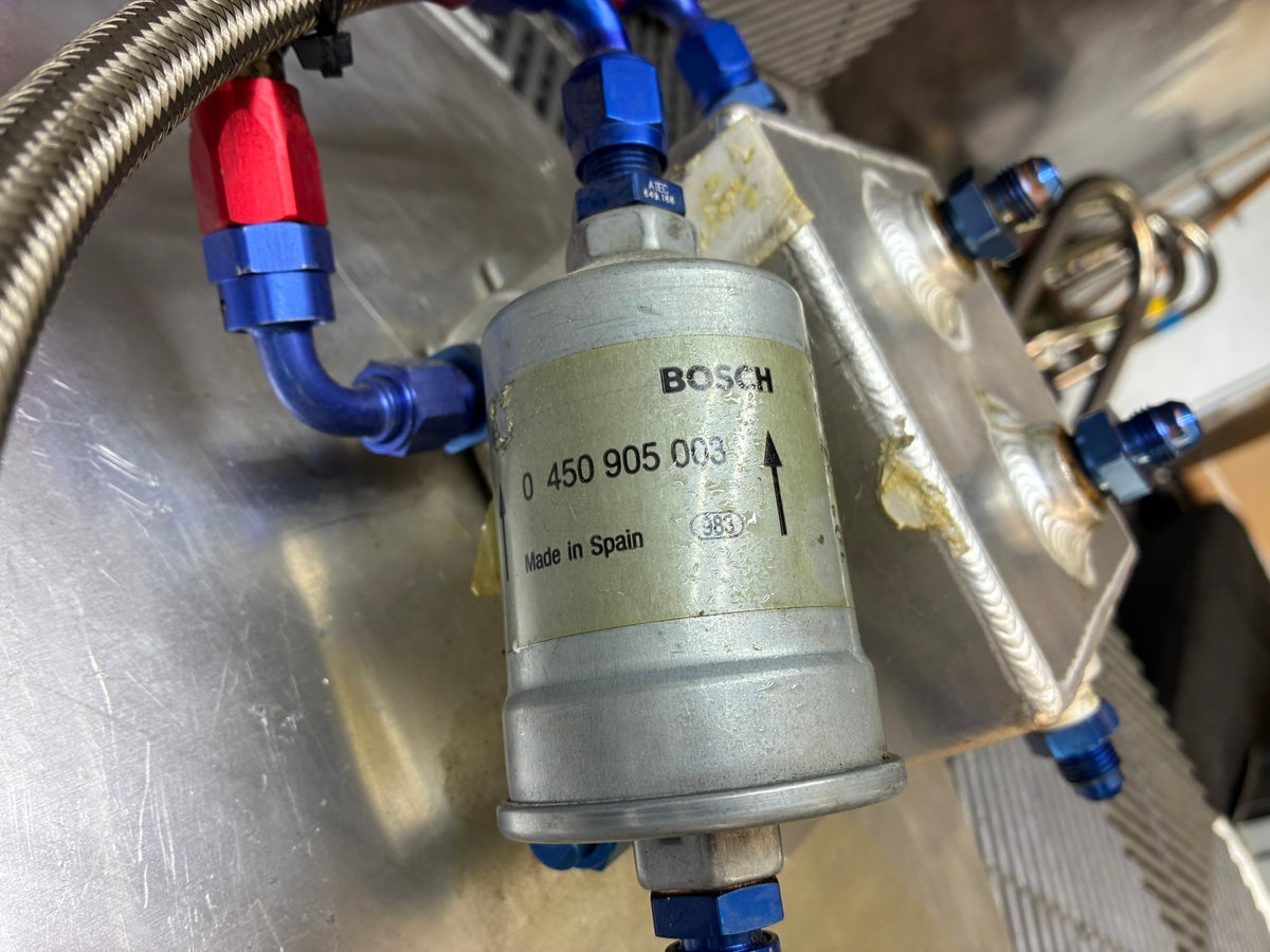 Used. Fuel surge tank and pump assembly mounted on an aluminum baseplate.